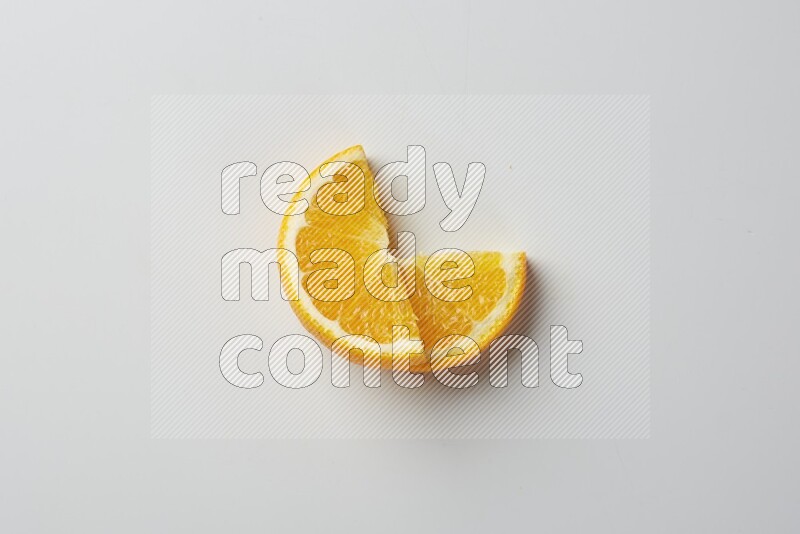 Two halves of an orange slices on white background