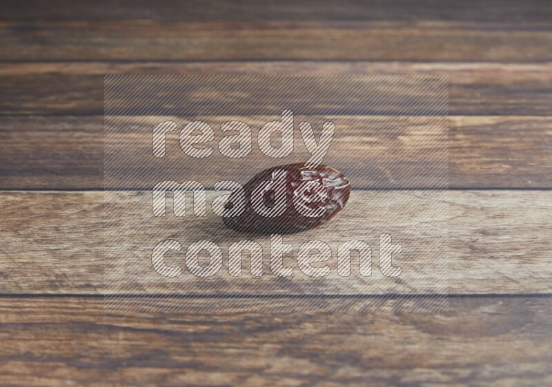 one madjoul date on a wooden background