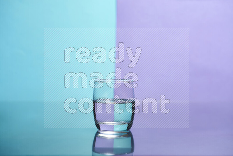 The image features a clear glassware filled with water, set against light blue and light purple background