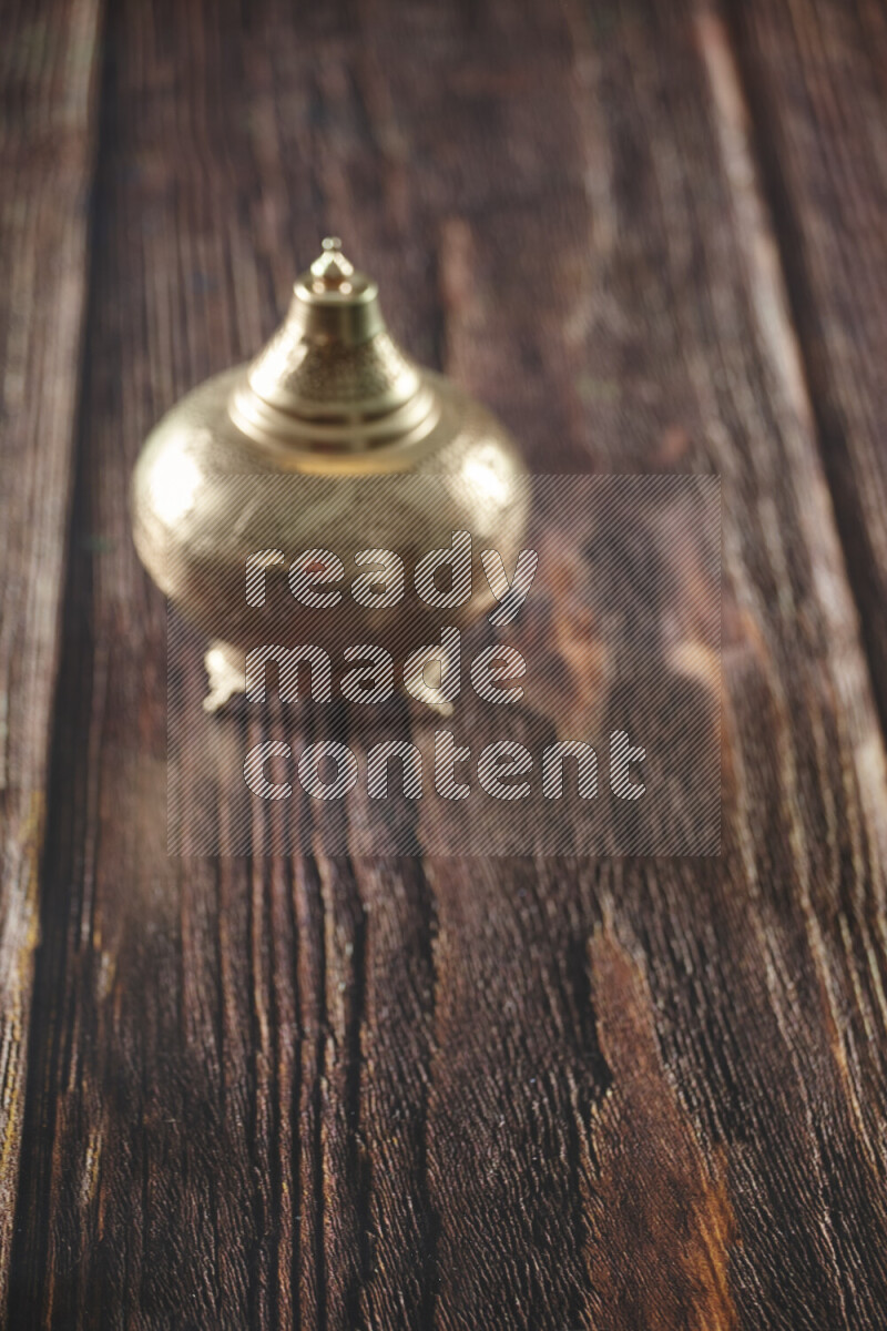 A lantern placed on a wooden background