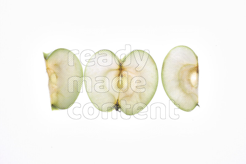 Apple slices on illuminated white background