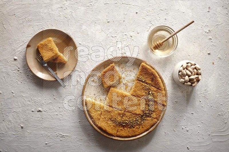 Konafa with nuts and honey in a light setup