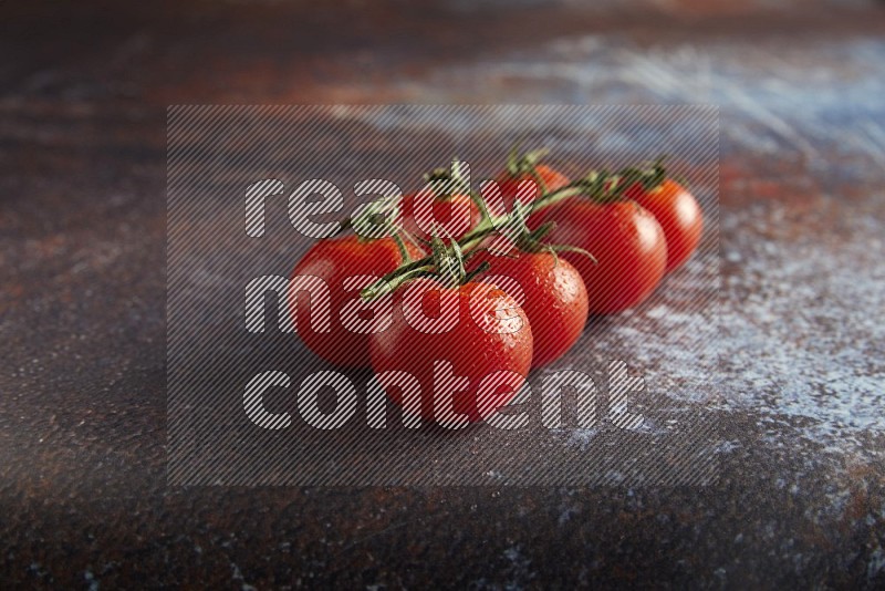 red cherry tomato vein on a reddish rustic metal background 45 degree