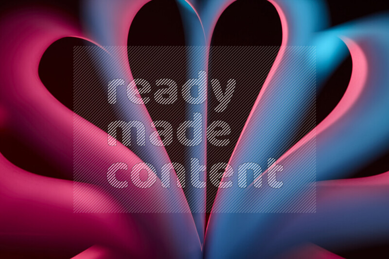 فن تجريدي يعرض منحنيات وتدرجات اللون الأزرق والأحمر مكونه بضوء ملون