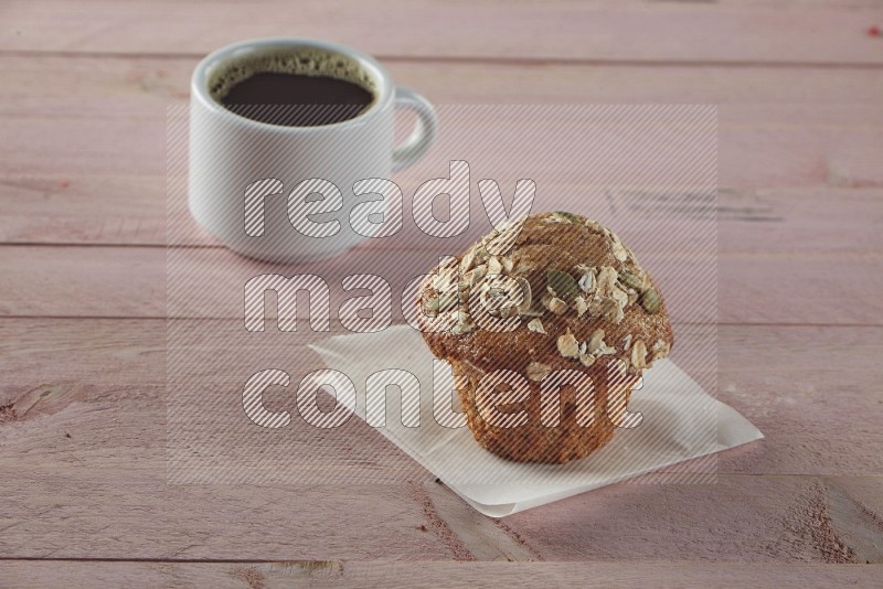 Multigrain cupcake on a wooden pink background
