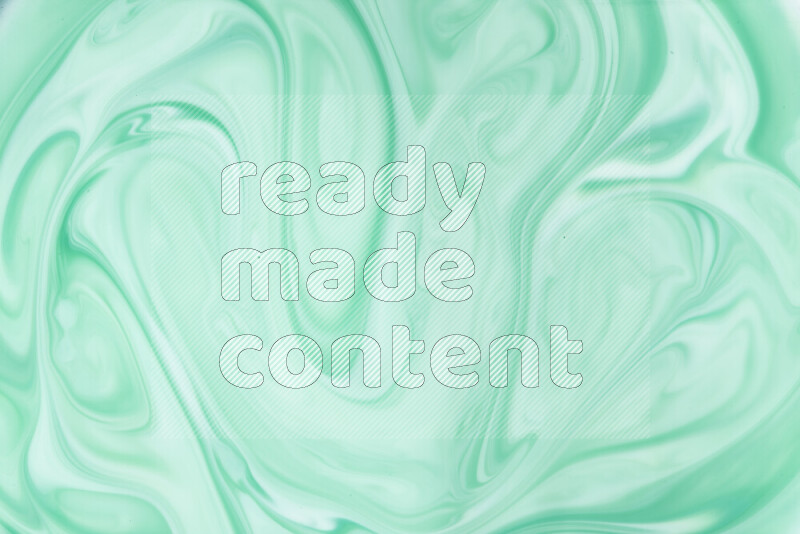 A close-up of abstract swirling patterns in green gradients
