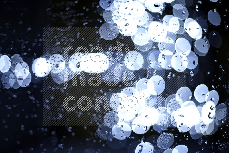 Bokeh light in white with water drops