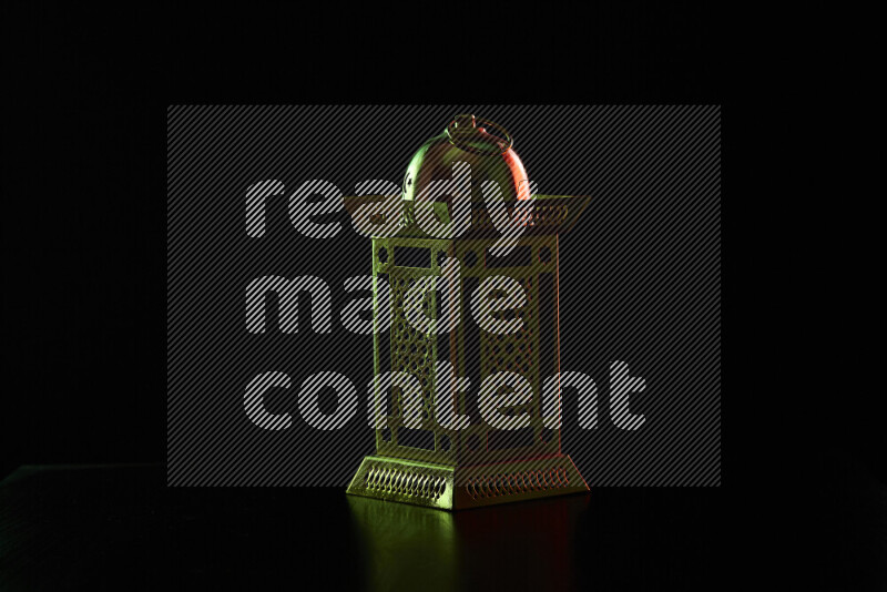 Ramadan lanterns with colored rim light against black background