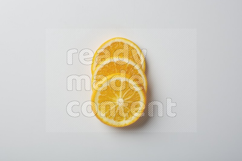 Three orange slices on a white background
