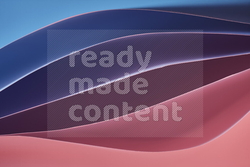 هذه الصورة تعرض تكوين فن الورق التجريدي مع منحنيات ورقية بتدرجات اللون الأزرق والارجواني والأحمر المكونه بواسطة الضوء الملون