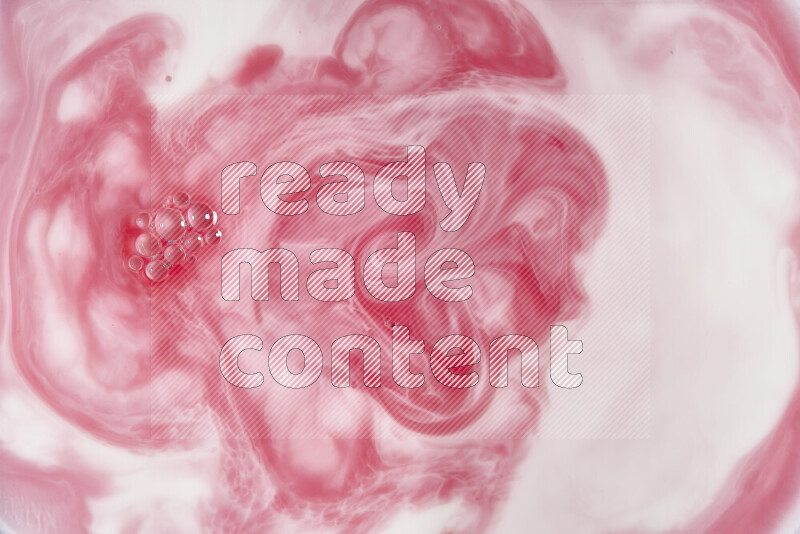 A close-up of abstract swirling patterns in red and white