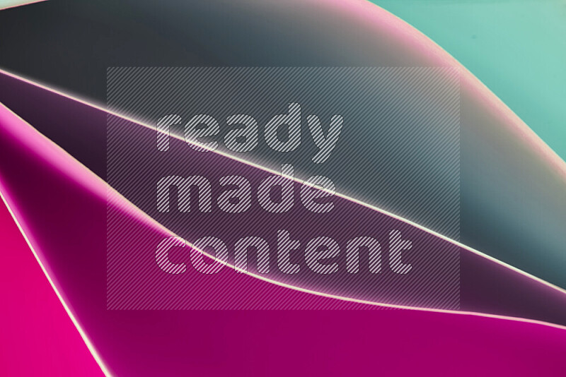This image showcases an abstract paper art composition with paper curves in green and pink gradients created by colored light
