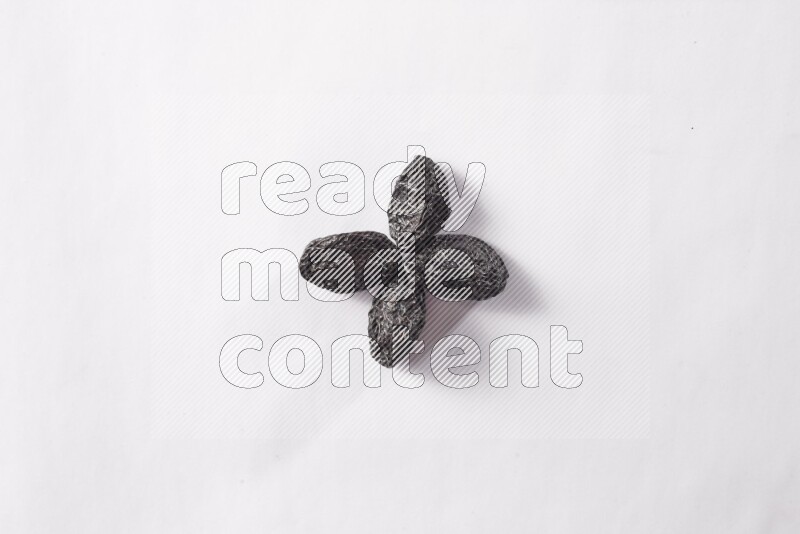 Dried plums on white background