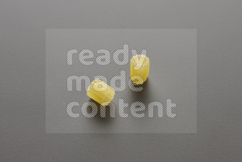 Small rings pasta on grey background