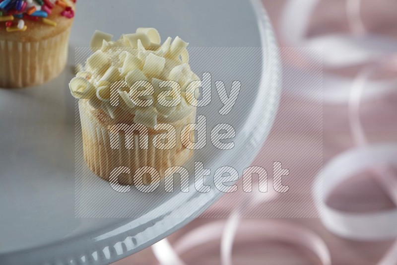 Vanilla mini cupcake topped with white chocolate curls