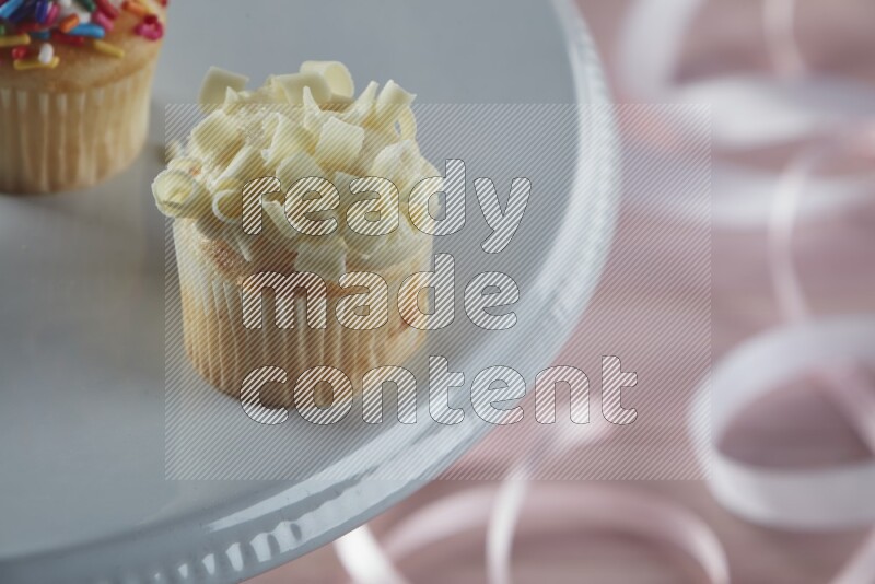 Vanilla mini cupcake topped with white chocolate curls