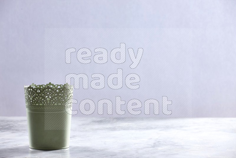 An Empty Light Green Plant Pot on light grey Marble Flooring 15 degree angle