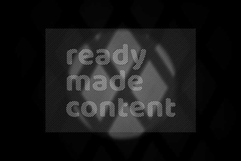 مجموعة من ضوء الغوبو الخافت تظهر أنماط هندسية علي سطح ناعم