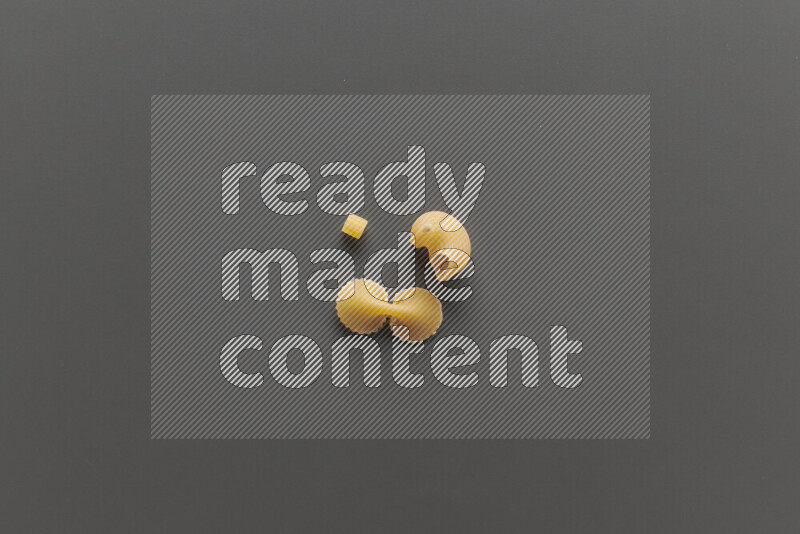 Different pasta types on grey background
