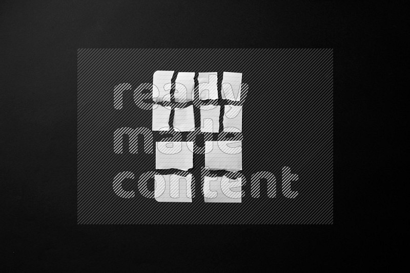 Ripped notebook sheet on black background