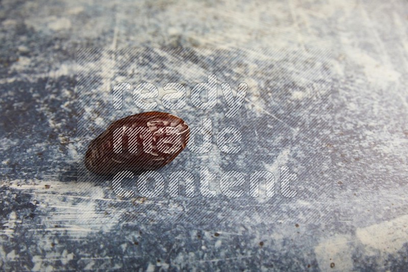 one madjoul date on a rustic blue backround