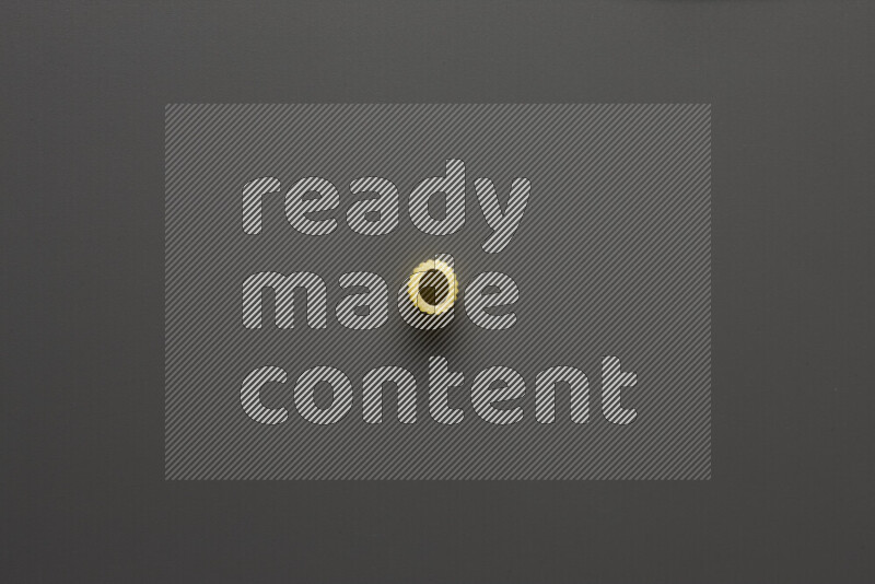 Big rings pasta on grey background