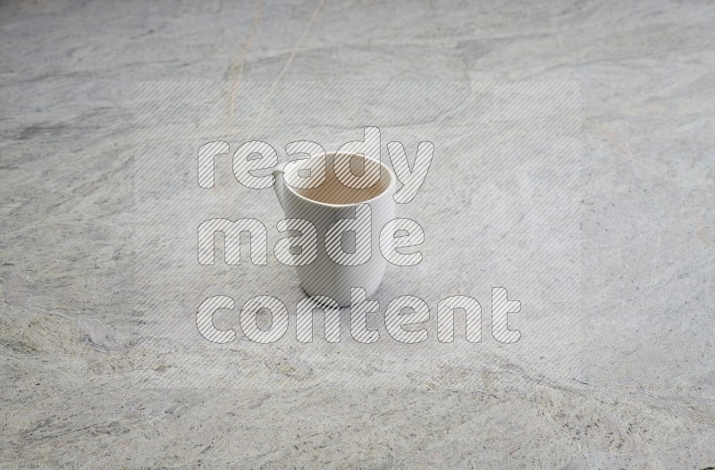 White Ceramic Mug On Grey Marble Flooring