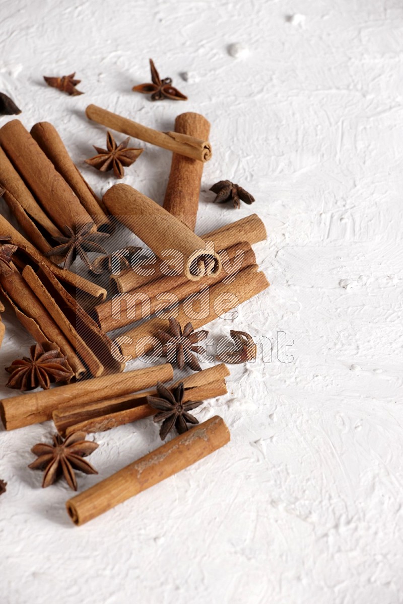cinnamon sticks with star anise on white background