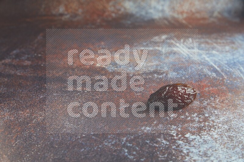 one madjoul date on a rustic reddish background
