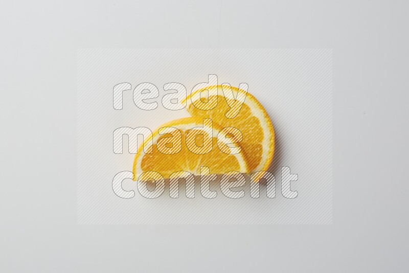 Two halves of an orange slices on white background