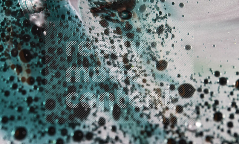 Close-ups of abstract green watercolor drops on oil Surface on white background