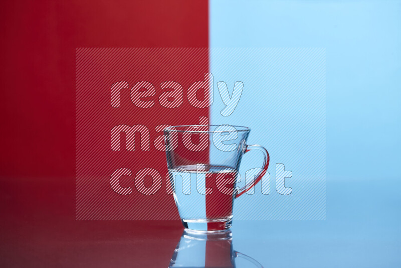 The image features a clear glassware filled with water, set against red and light blue background