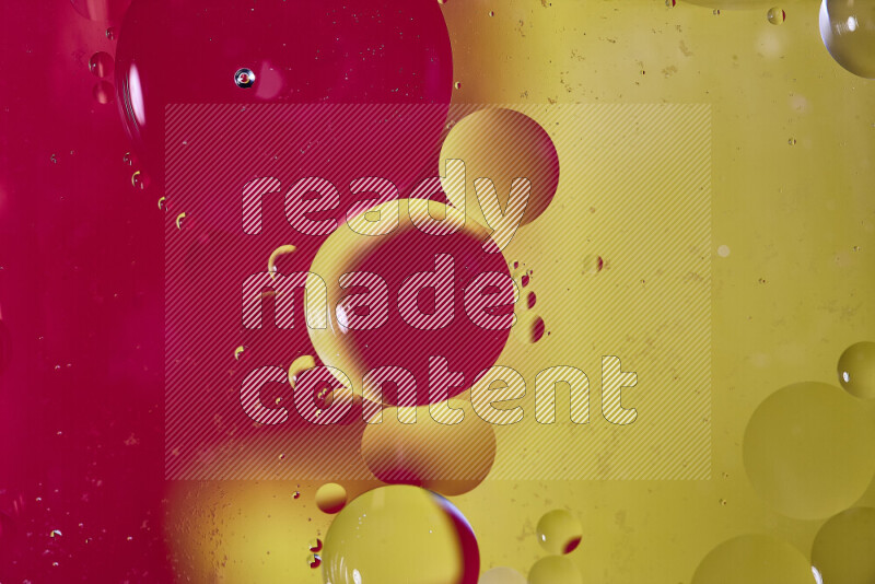 Close-ups of abstract oil bubbles on water surface in shades of red and yellow