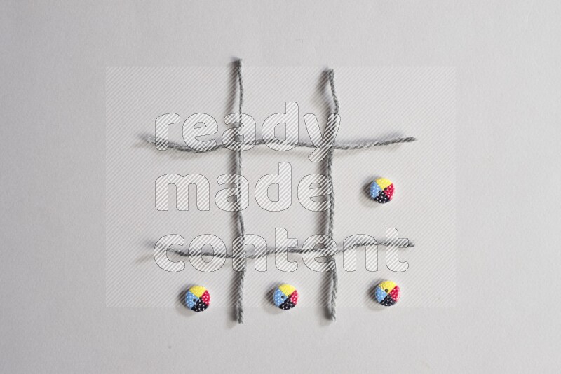 Multicolored buttons placed on grey background