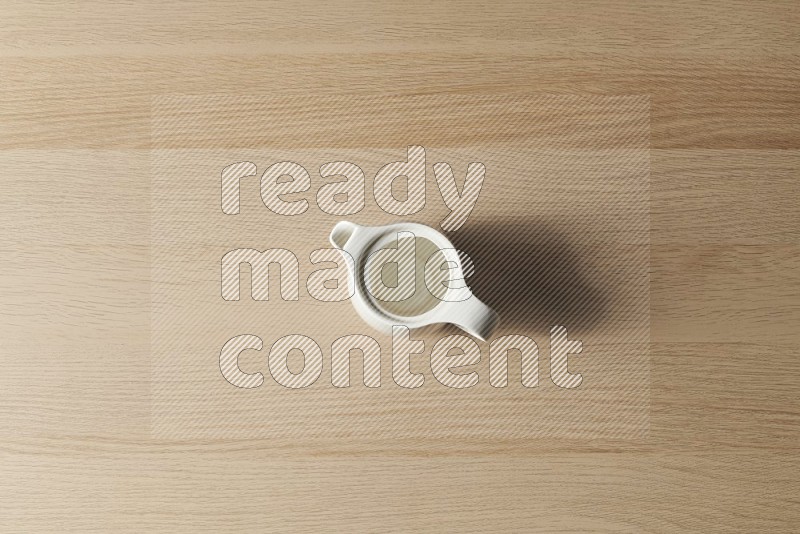 Top View Shot Of A Ceramic Milk Jug on Oak Wooden Flooring