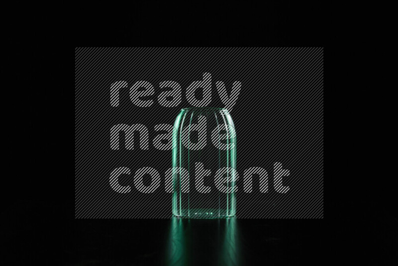 Glassware with rim light in green against black background