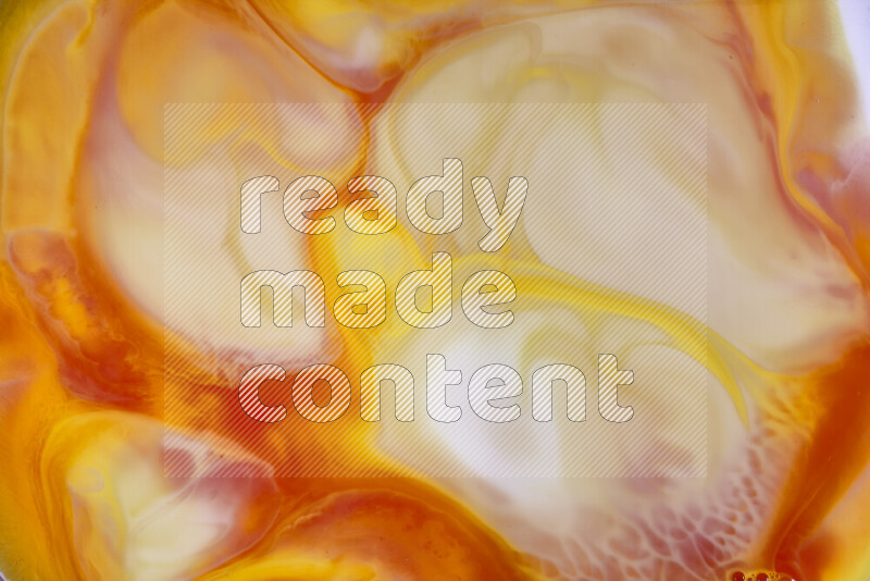 A close-up of abstract swirling patterns in orange, red and white