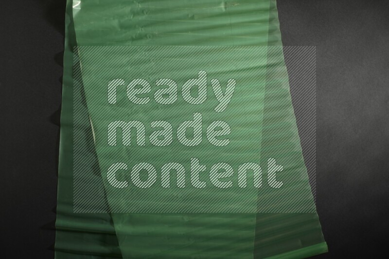 Colored plastic textures on black background