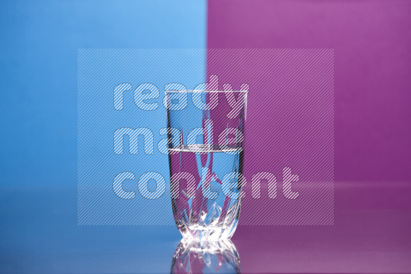 The image features a clear glassware filled with water, set against blue and purple background