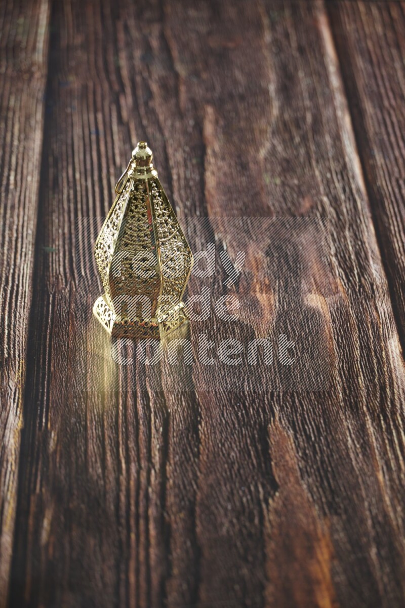 A lantern placed on a wooden background