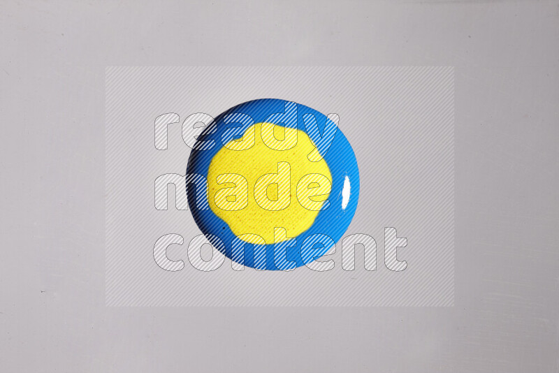 Close-ups of assorted colors blending on a grey background