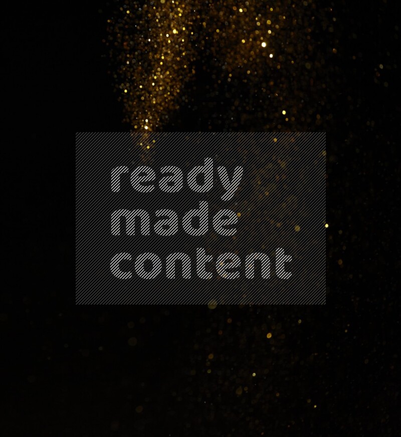 Gold glitter powder isolated on black background