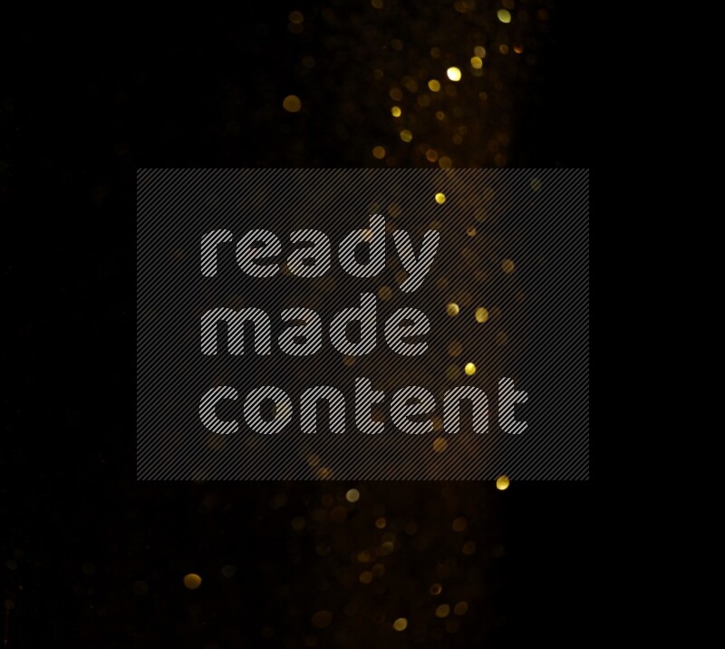 Gold glitter powder isolated on black background