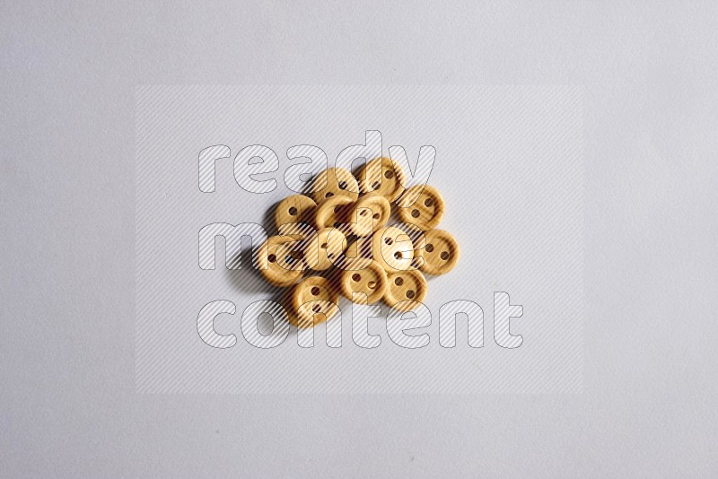 Wooden buttons on grey background