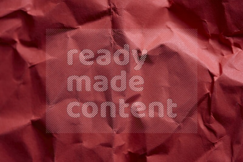 Crumpled craft paper on black background