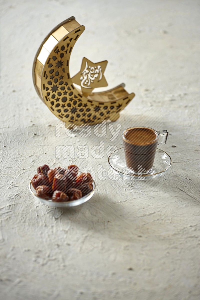 A wooden golden crescent lantern with different drinks, dates, nuts, prayer beads and quran on white background