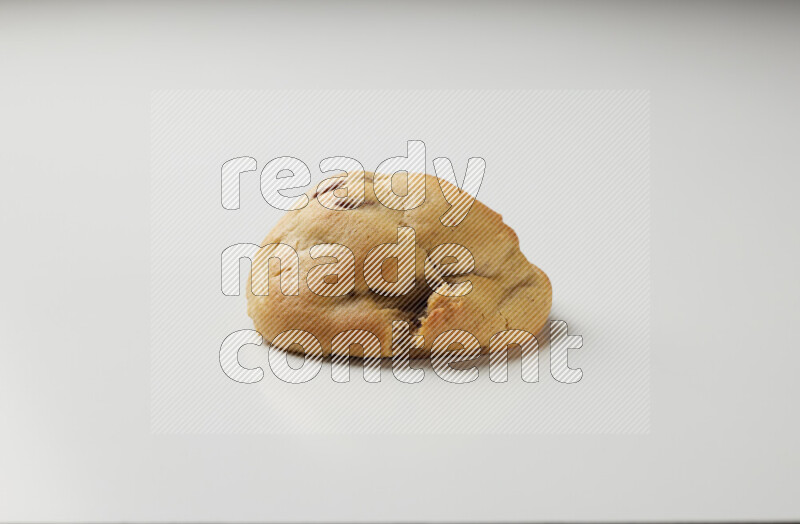a chocolate chip cookie on a white background