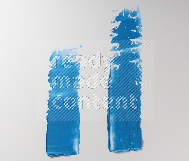 Blue painting knife strokes on white background