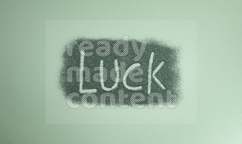 A word written with green glitter on green background