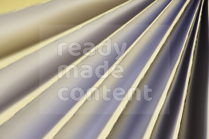 An image presenting an abstract paper pattern of lines in white and gold tones